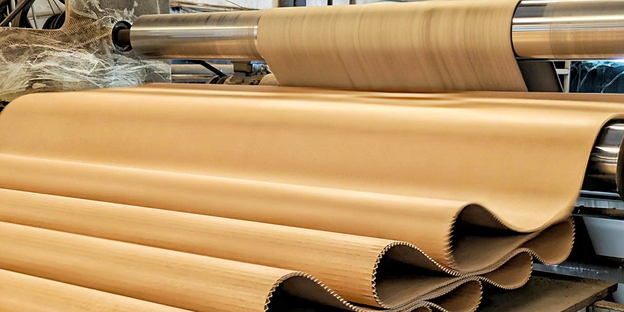 Corrugated board production using linerboard and fluted paper